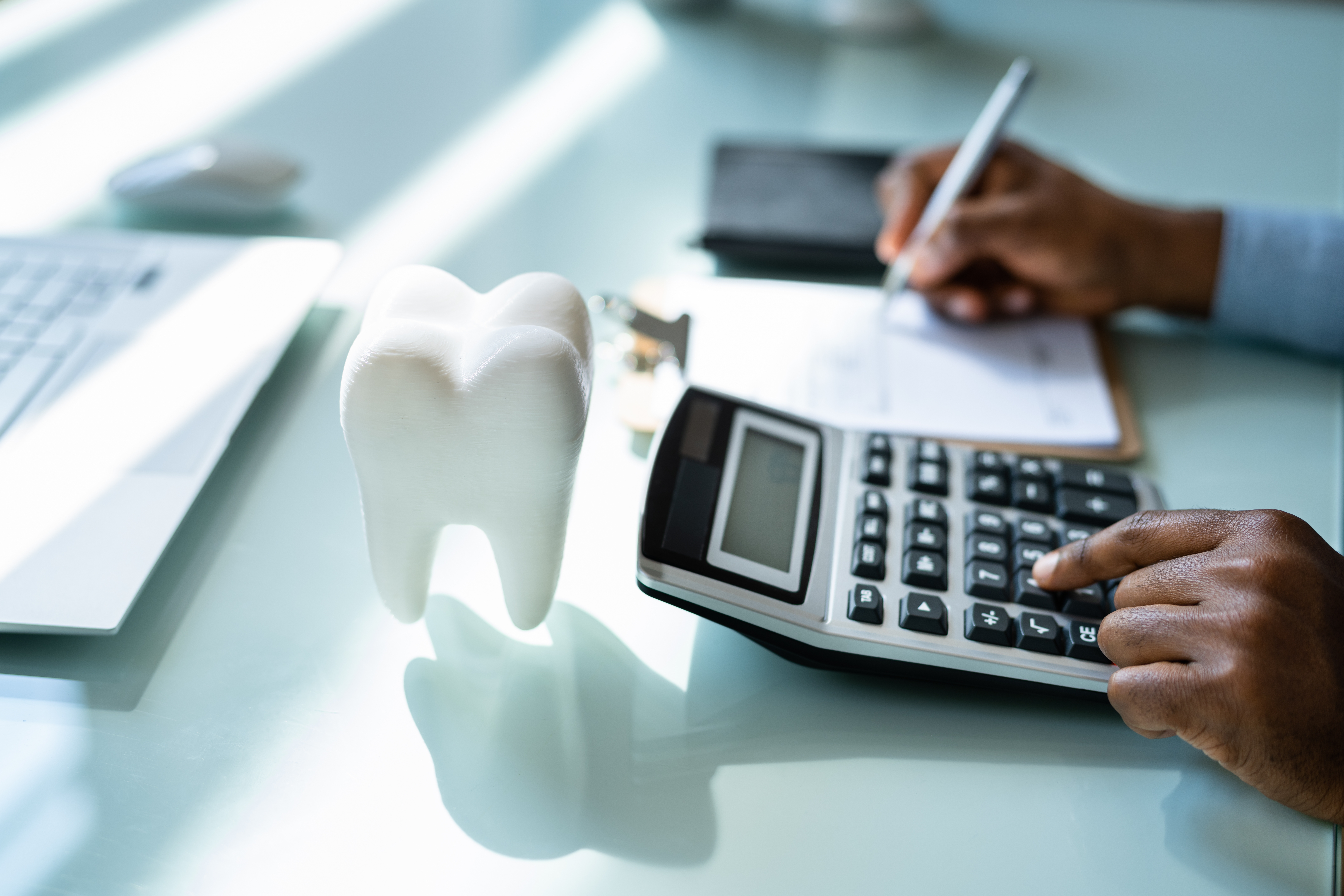 Calculating the cost of full mouth dental implants.